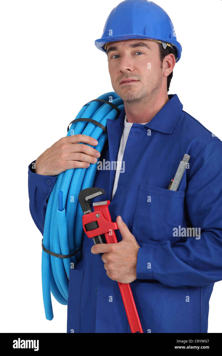 Operator with blue tube roll Stock Photo Alamy