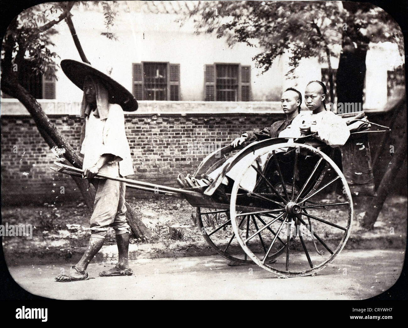 Cooly Boy Pulling Shanghai Boys, China, ca 1870, William Saunders Stock Photo