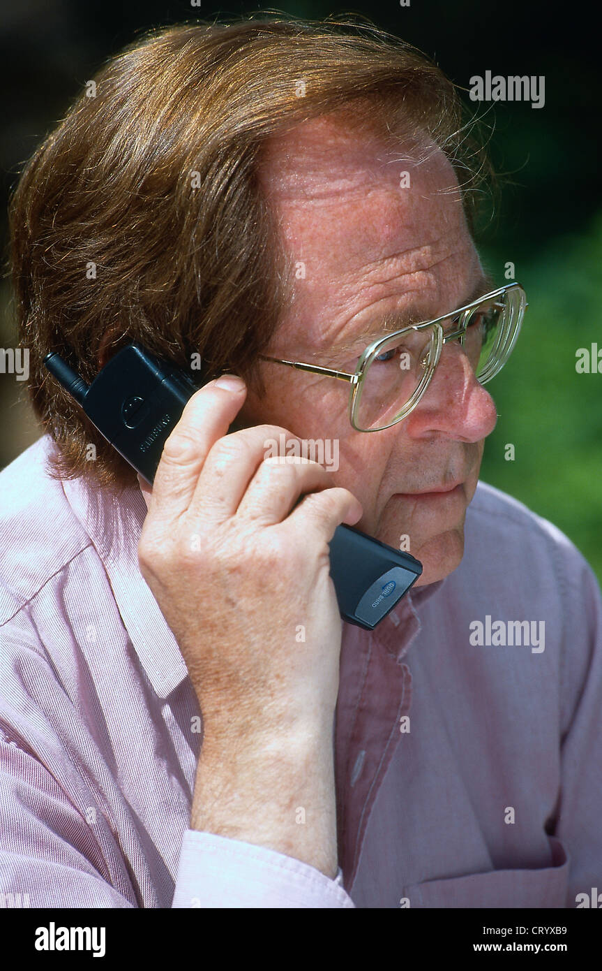 ELDERLY PERSON ON THE PHONE Stock Photo