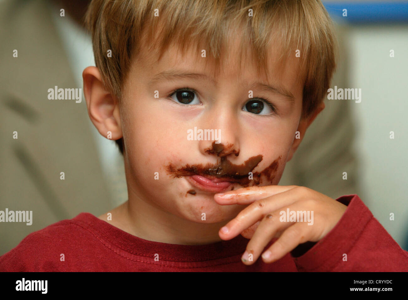 Boy with Chocolate Schnute Stock Photo