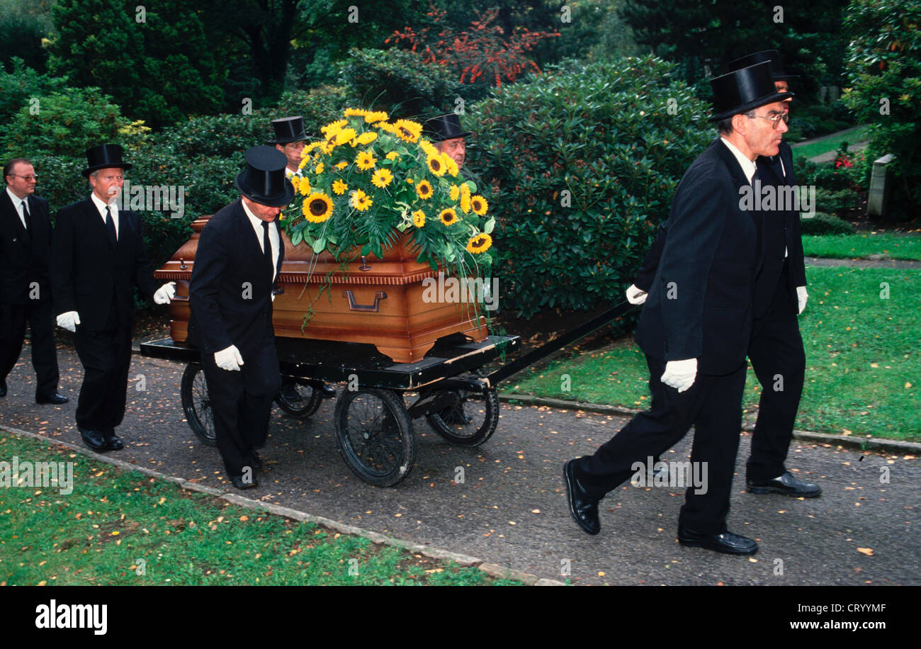Funeral casket with flowers Stock Photo