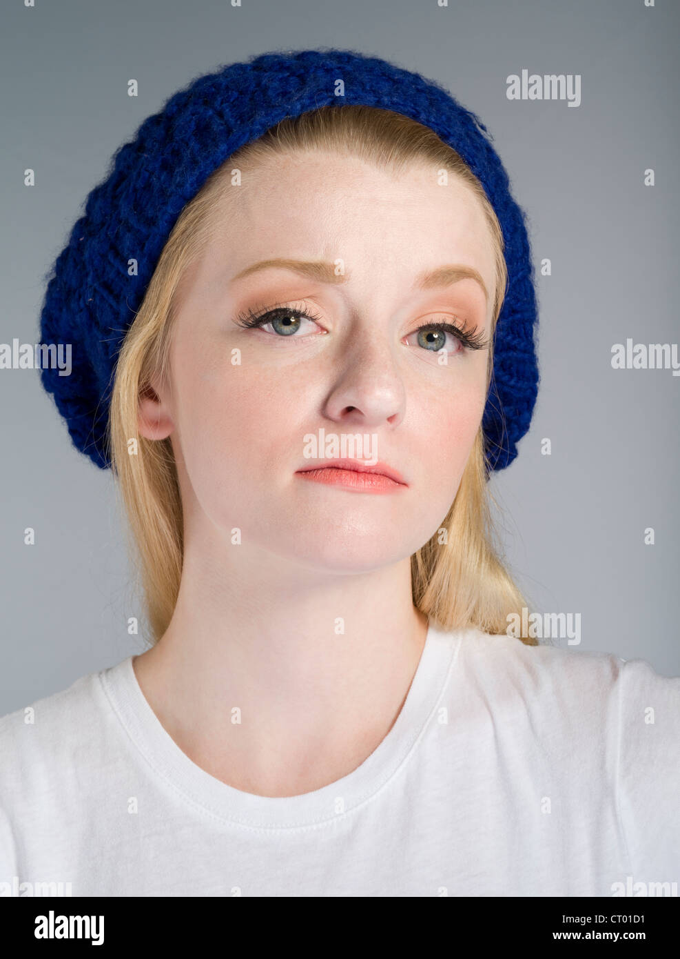 Beautiful girl shows a mean girl look of contempt Stock Photo