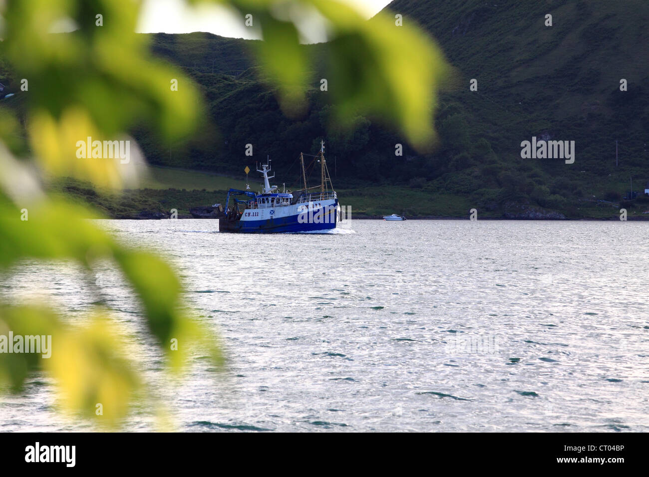Fishing boat sailing up the Sound of Kerrara, near Oban, Scotland Stock Photo