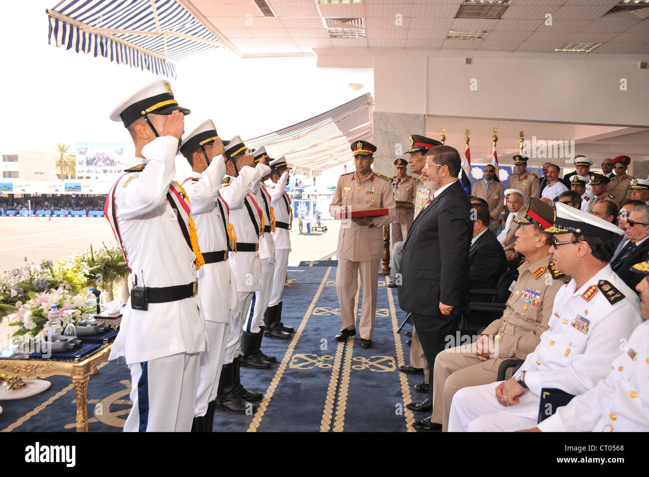 Egypt's President Morsi attends Naval Academy  graduation cermonies with Military head Hussein Tantawi and other senior figures. Stock Photo