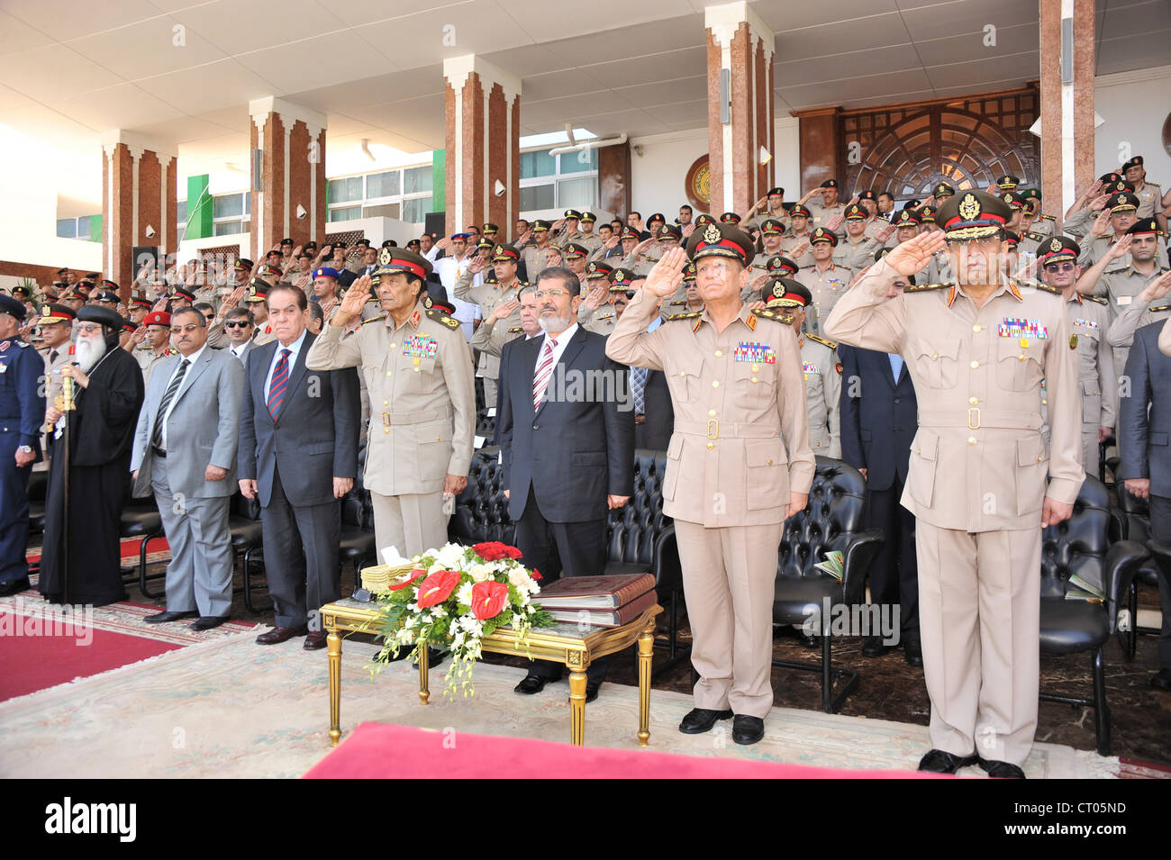Egypt's President Morsi attends Civil Aviation graduation cermonies with Military head Hussein Tantawi and other senior figures. Stock Photo