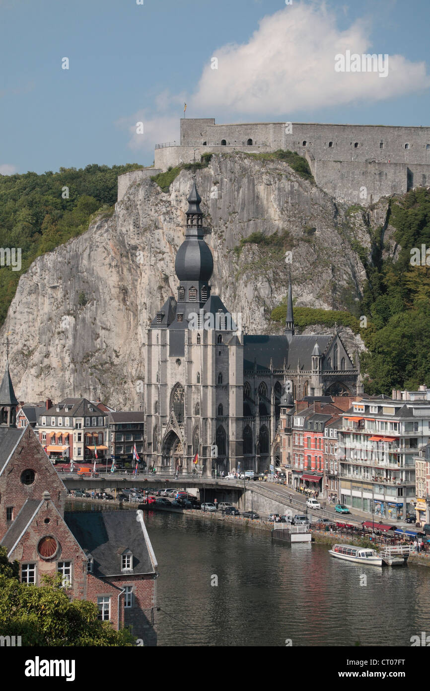 View down the River Meuse towards the Collegiate Church of Notre-Dame with the Citadel behind and above, Dinant, Namur, Belgium. Stock Photo