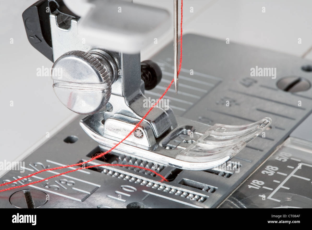 thread in needle of sewing machine Stock Photo Alamy