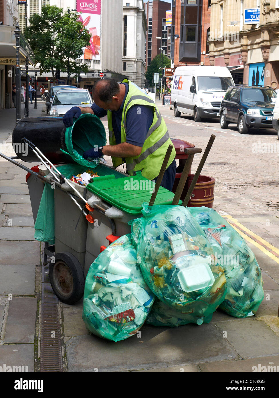 Council worker street cleaner in the city centre of Manchester UK Stock Photo