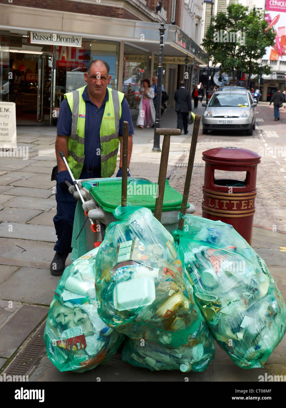 Council worker street cleaner in the city centre of Manchester UK Stock Photo