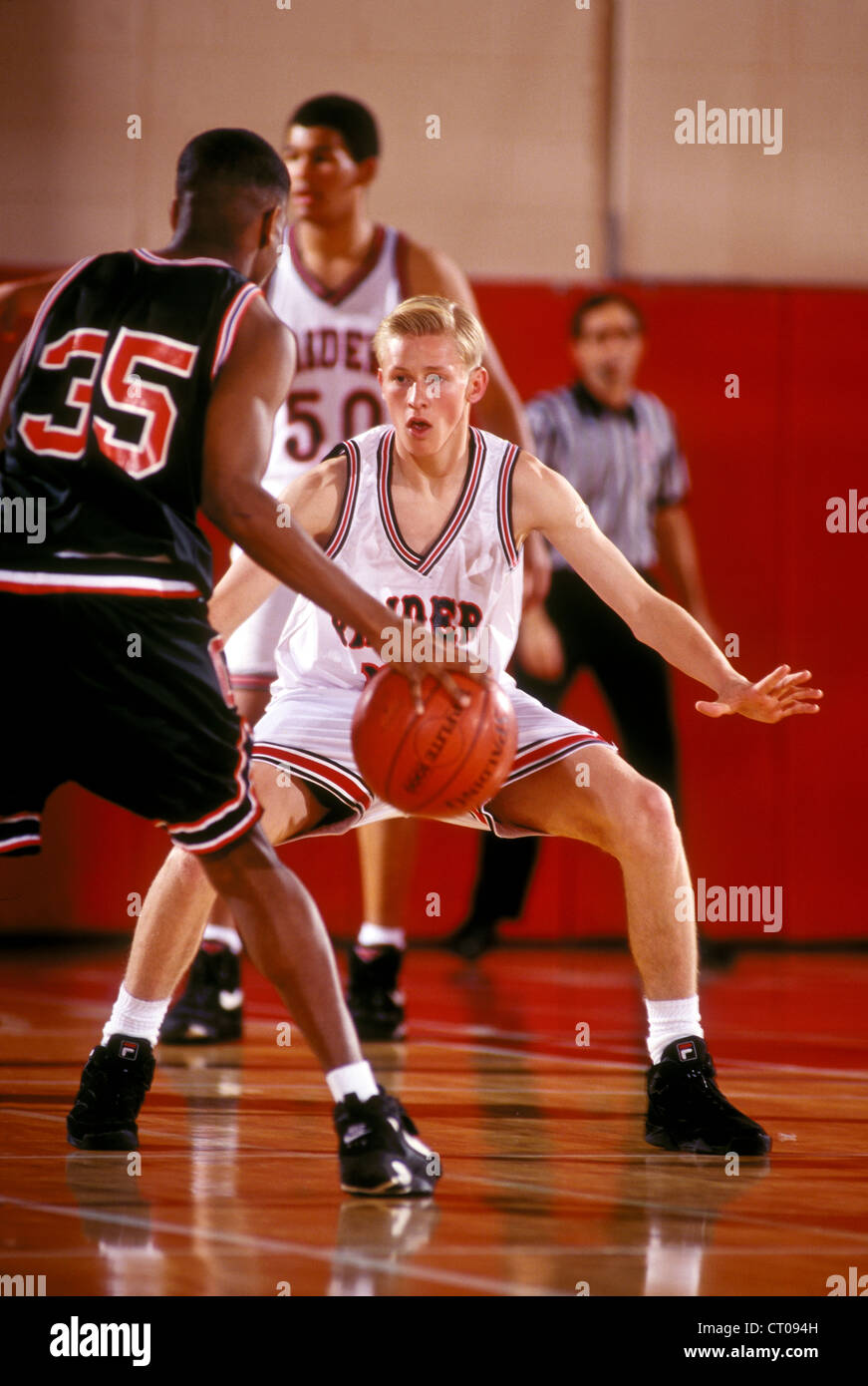 Boys High School basketball players during a game Stock Photo Alamy