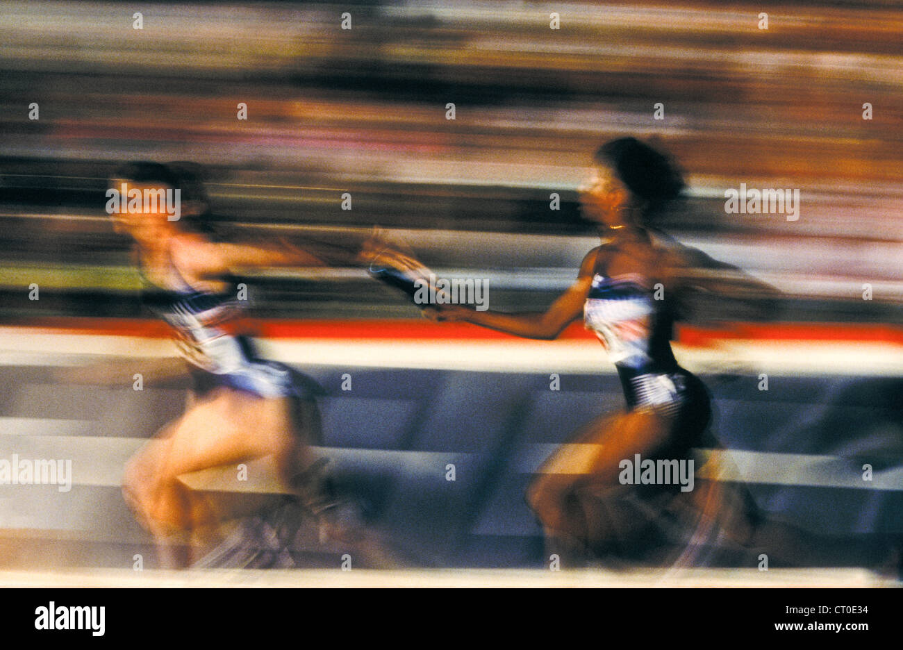 Track and field relay baton pass Stock Photo Alamy
