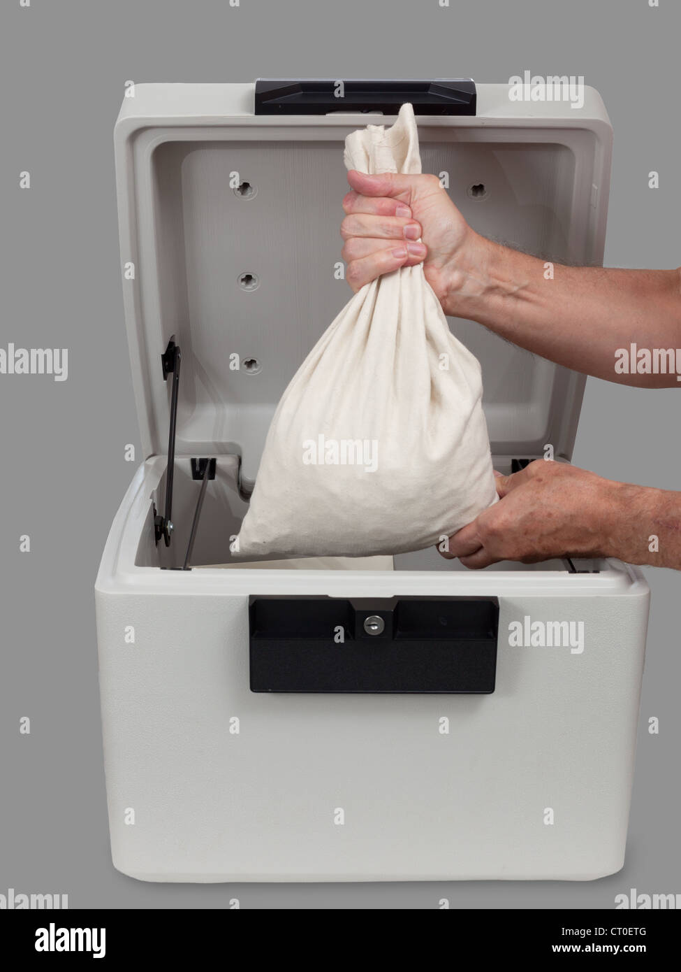 Fire Proof Safe Open And Large Cotton Cash Bag Being Placed Inside Stock Photo Alamy