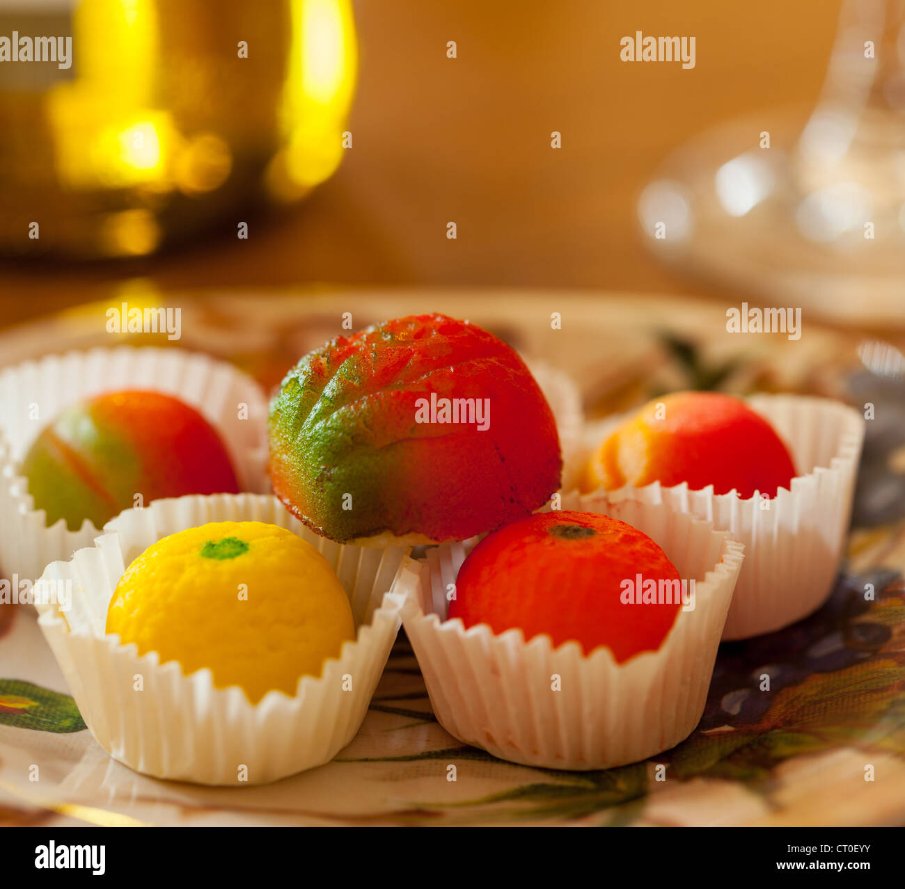 Fruit shaped candies in macro image of marzipan sweets on table with
