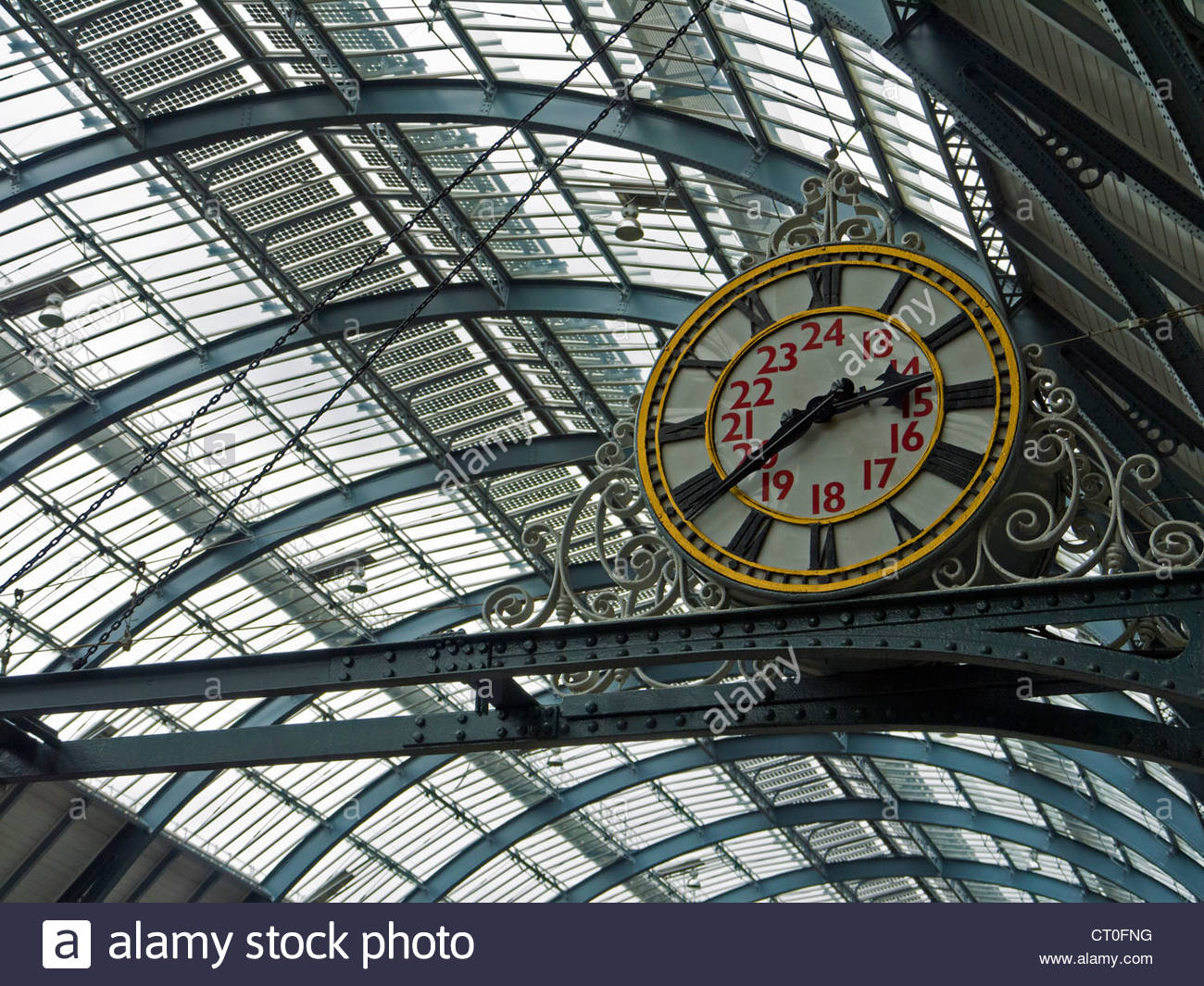 Kings Cross Railway Station old analogue Clock under roof London Stock