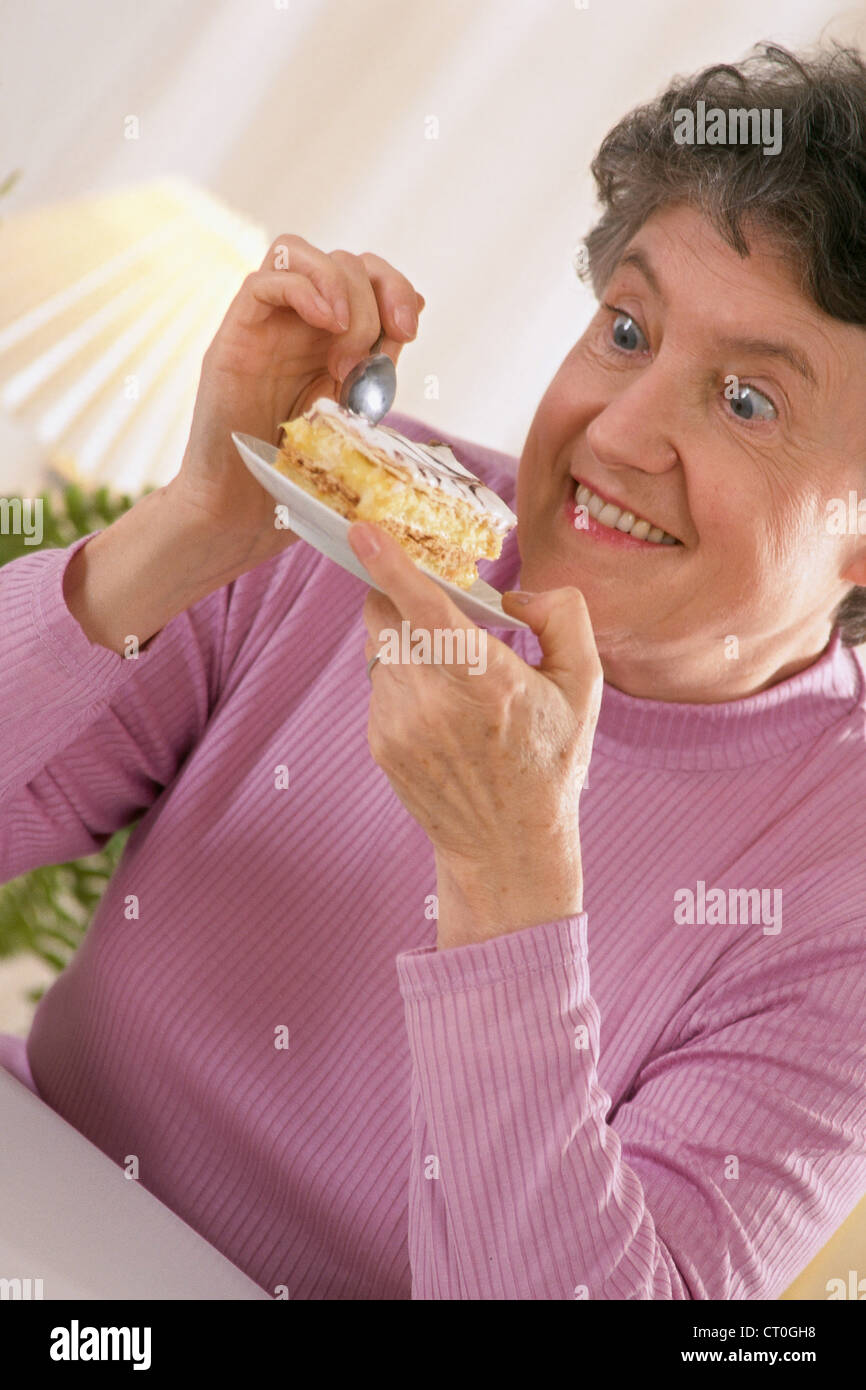 ELDERLY PERSON EATING SWEETS Stock Photo Alamy