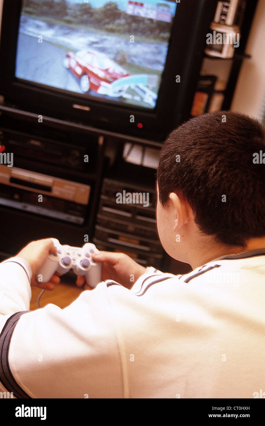 ADOLESCENT PLAYING VIDEO GAME Stock Photo Alamy