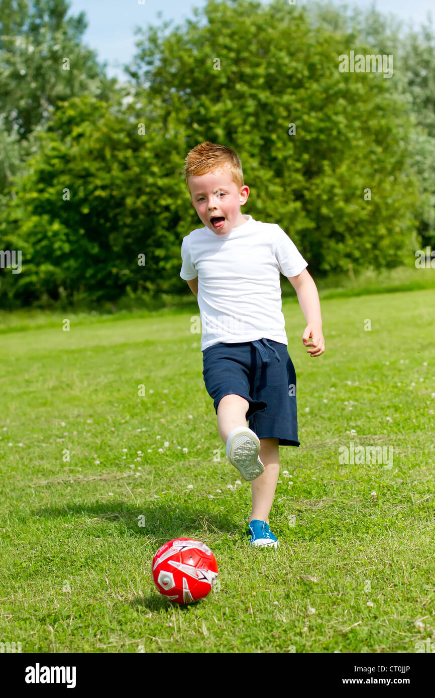 yoiung boy kicking a