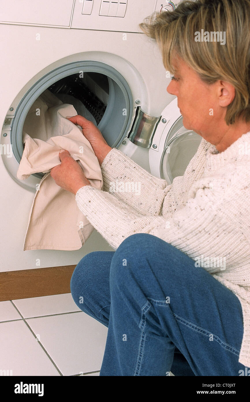 ELDERLY PERSON DOING LAUNDRY Stock Photo Alamy