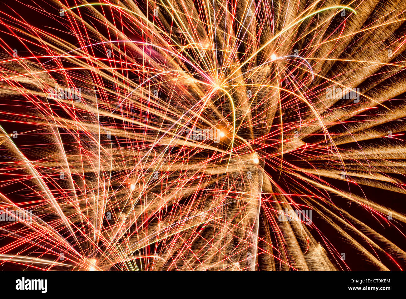 Brightly colored fireworks light up the night sky Stock Photo - Alamy