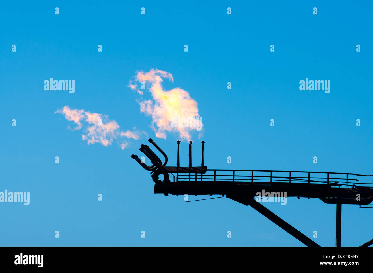 gas burning flare of an offshore oil rig. Coast of Brazil Stock Photo ...