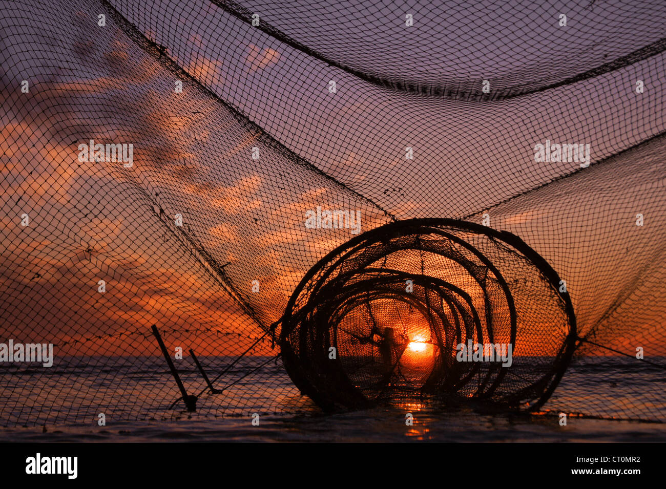 Fishing tackle, sunset and White sea Stock Photo Alamy