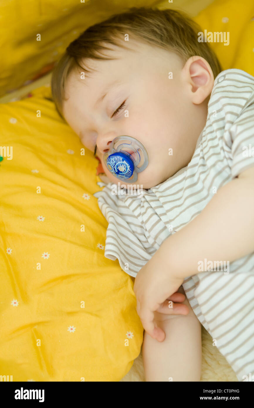 little babyboy sleeping in a bed Stock Photo Alamy