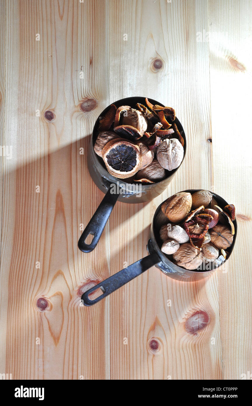 Two Victorian saucepans with dried fruit and nuts UK Stock Photo