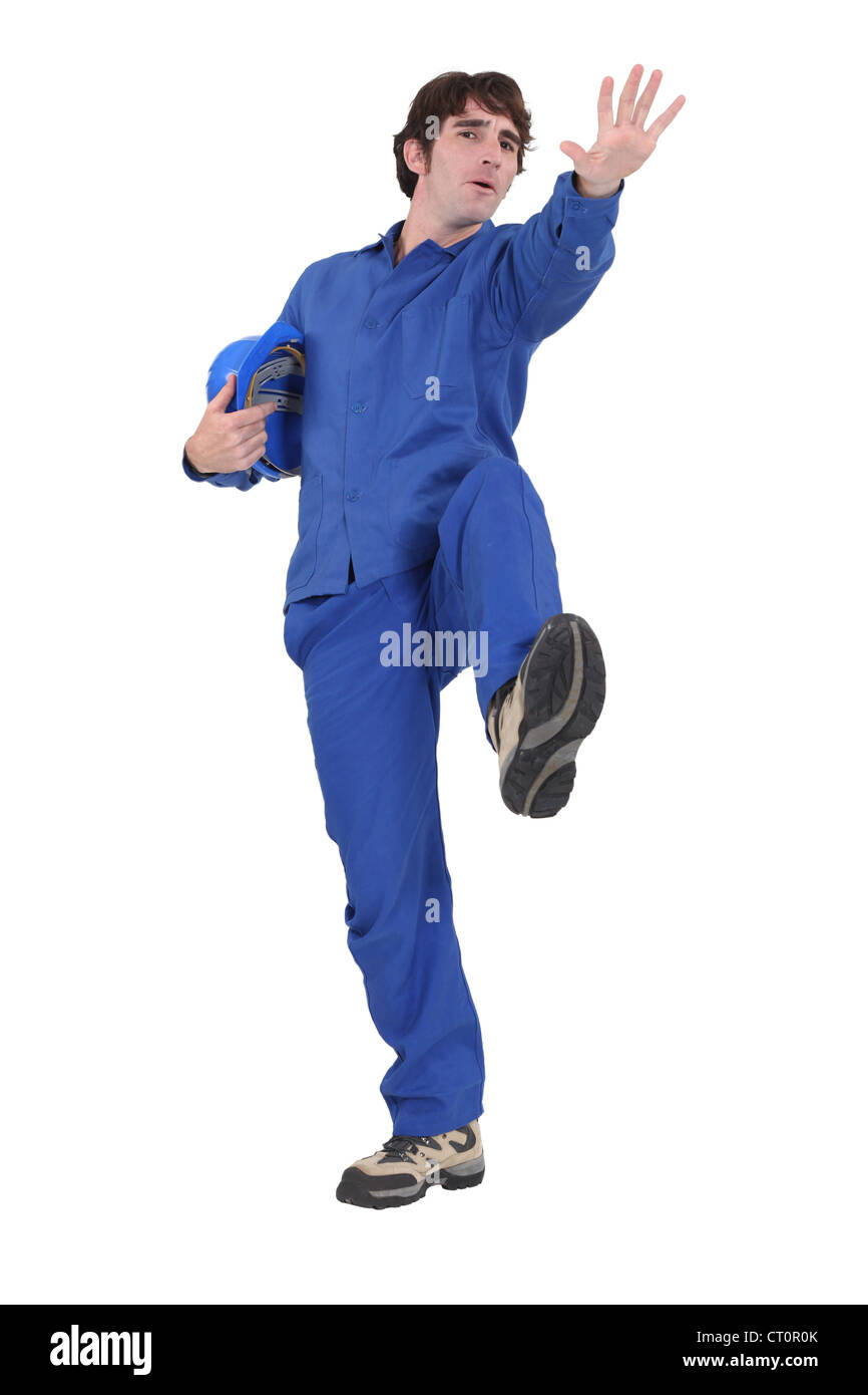 Builder slipping over Stock Photo - Alamy
