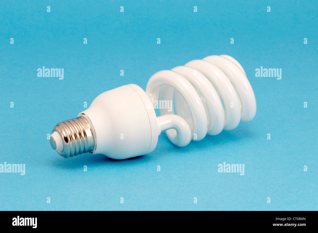 Novel fluorescent light bulb on blue background. New technology for