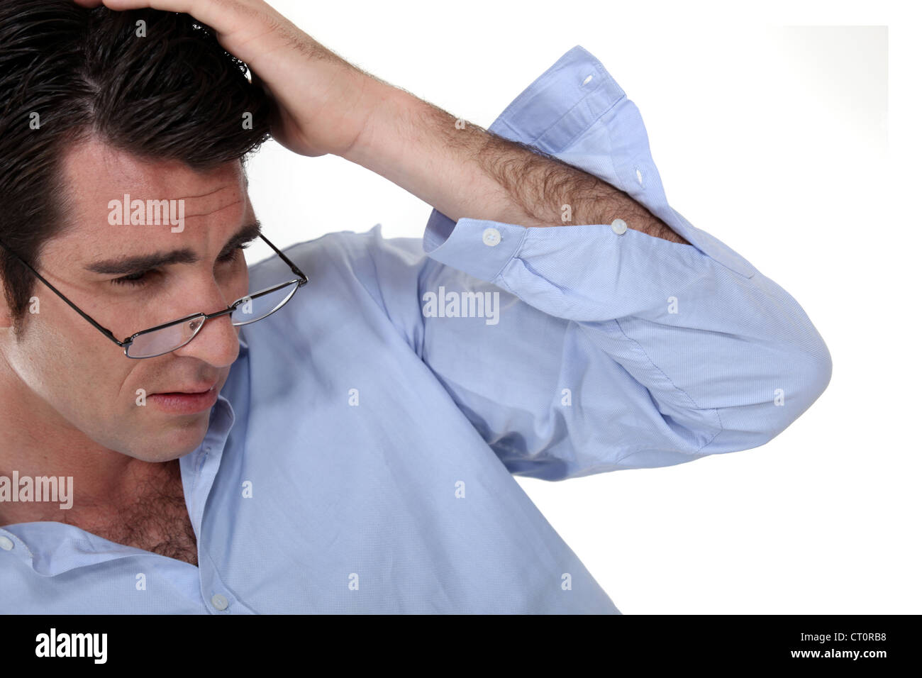 Businessman rubbing his head Stock Photo Alamy