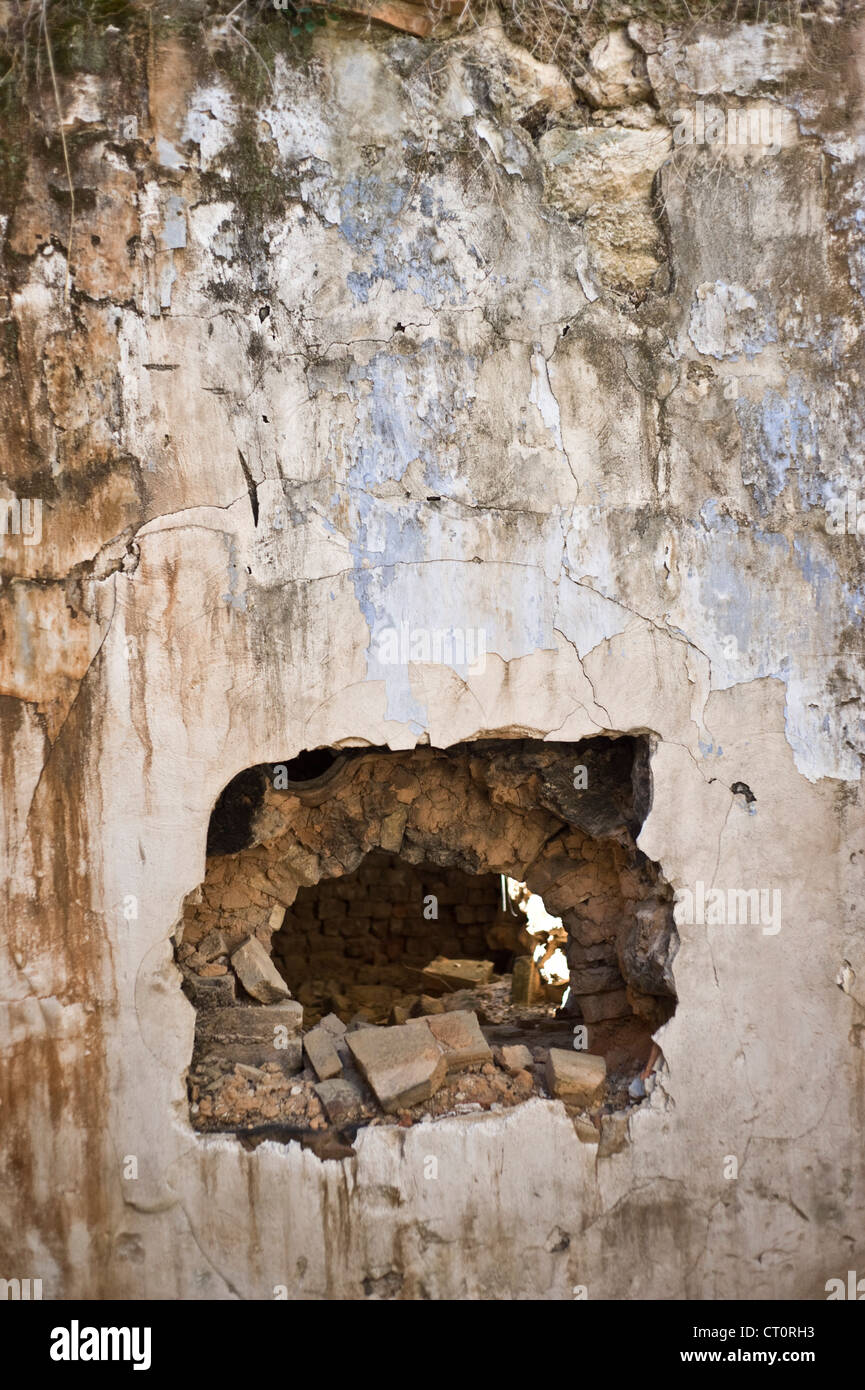 Hole on the old wall. Stock Photo