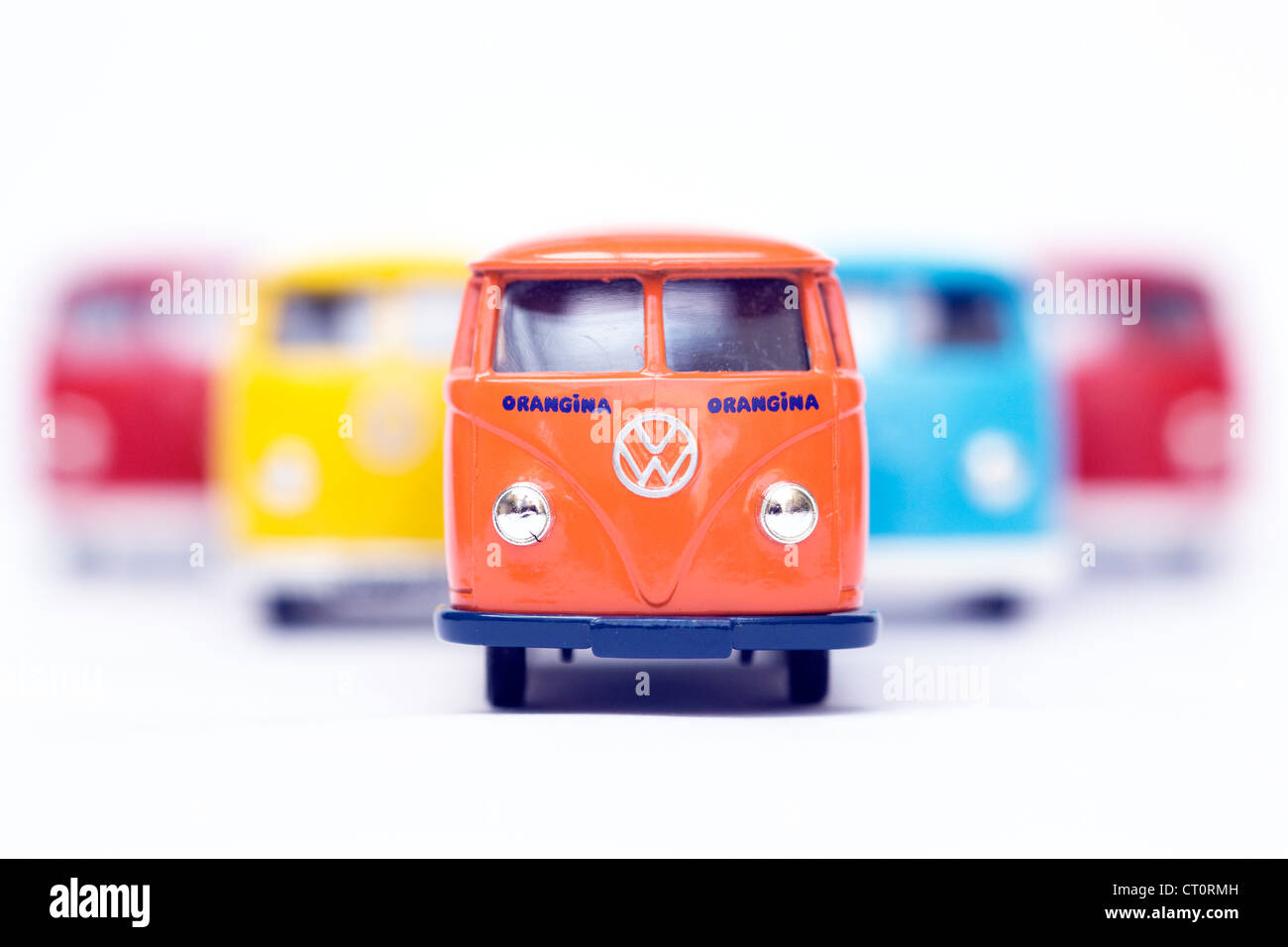 Children's collectible toy model of Five Volkswagen split screen panel fire van on white background Stock Photo