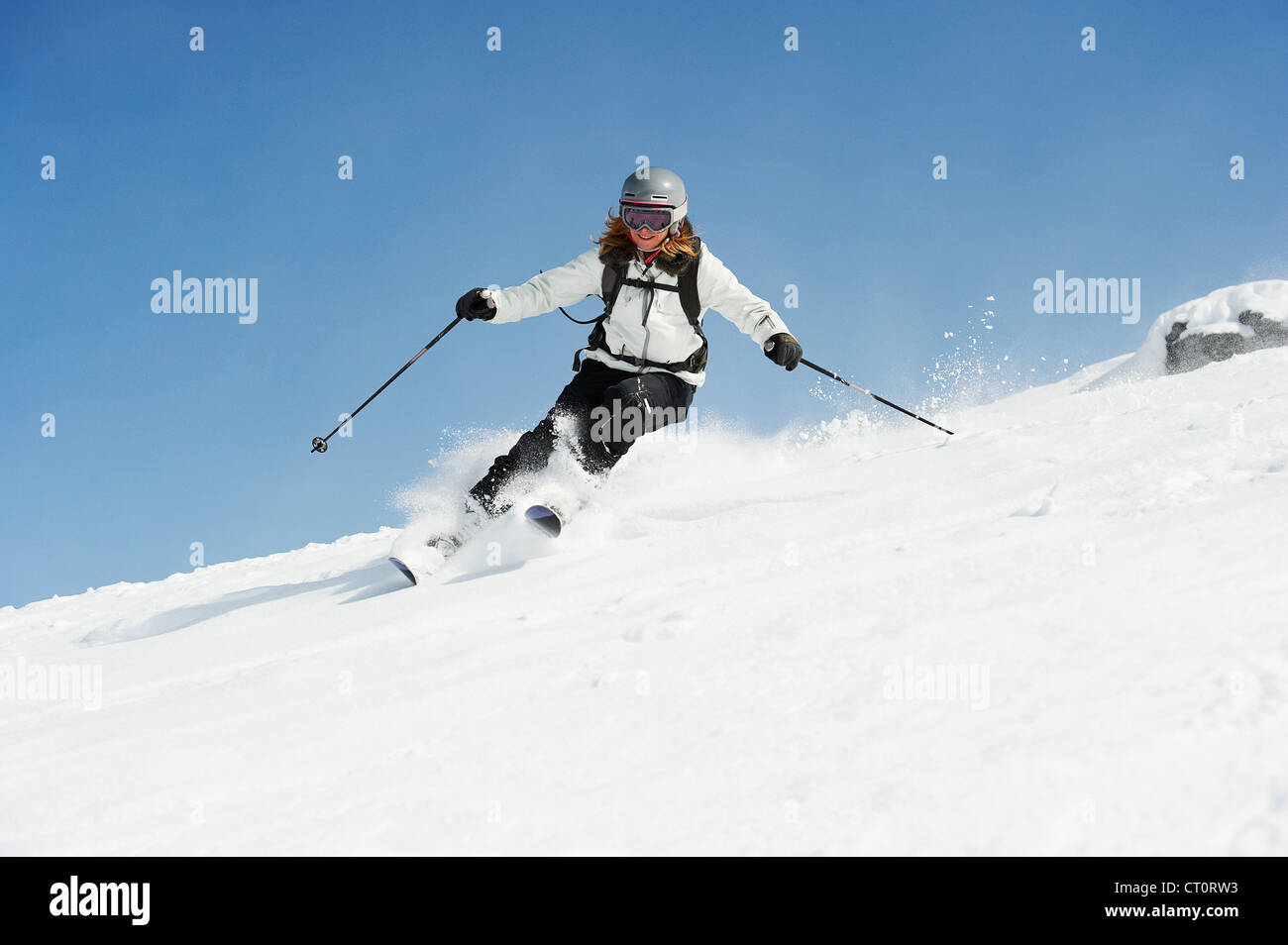 Skier skiing on snowy slope Stock Photo