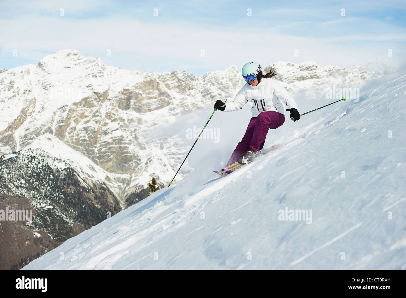 Skier skiing on snowy slope Stock Photo