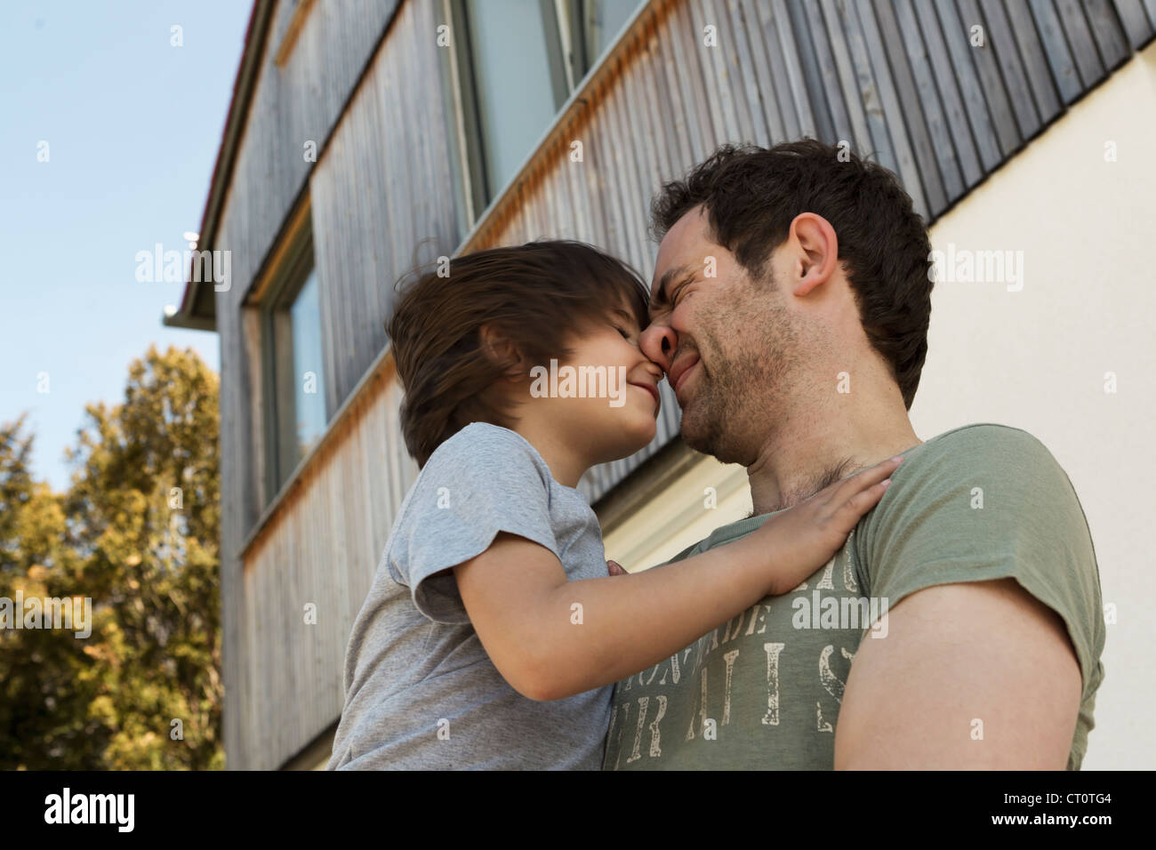 Father and son playing outdoors Stock Photo