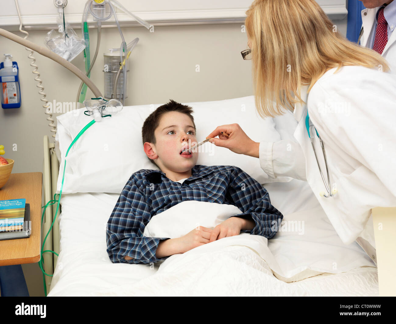 Doctor examining patient in hospital Stock Photo