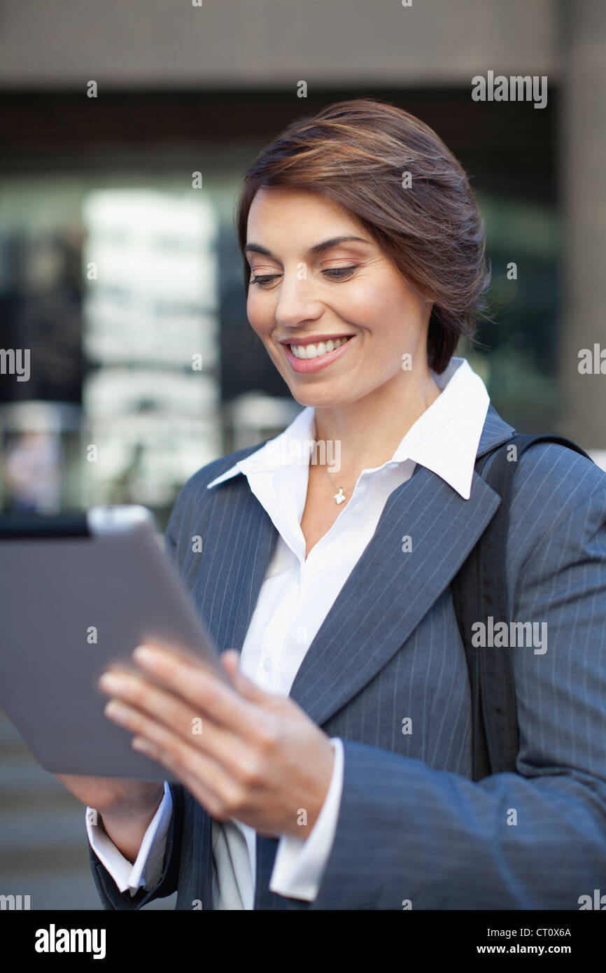 Businesswoman using tablet computer Stock Photo