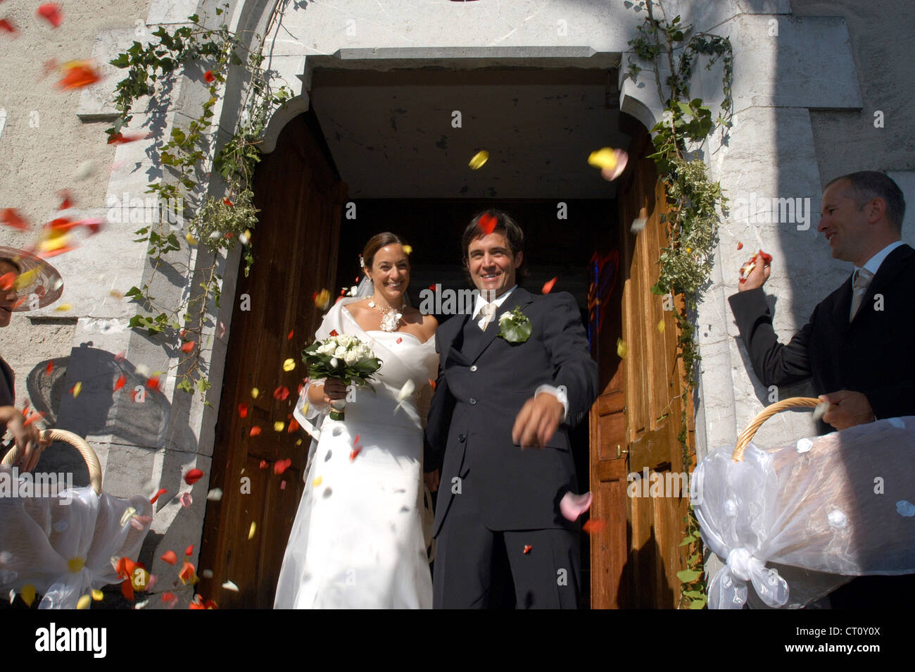 Wedding couple is leaving a church Stock Photo