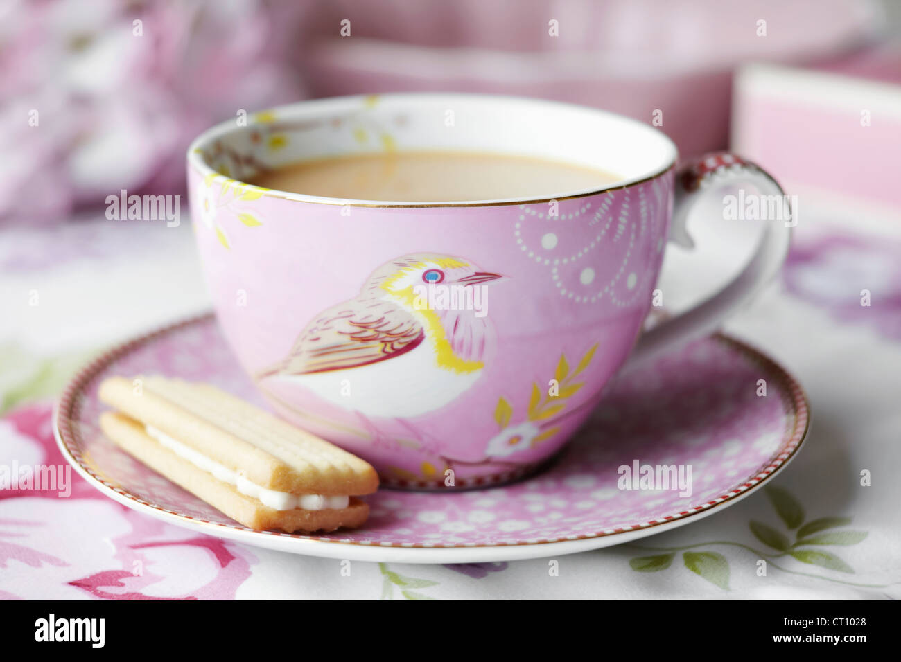 Close up of cup of tea and cookie Stock Photo