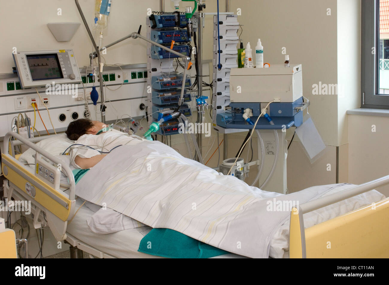 Patient In Hospital Bed Icu