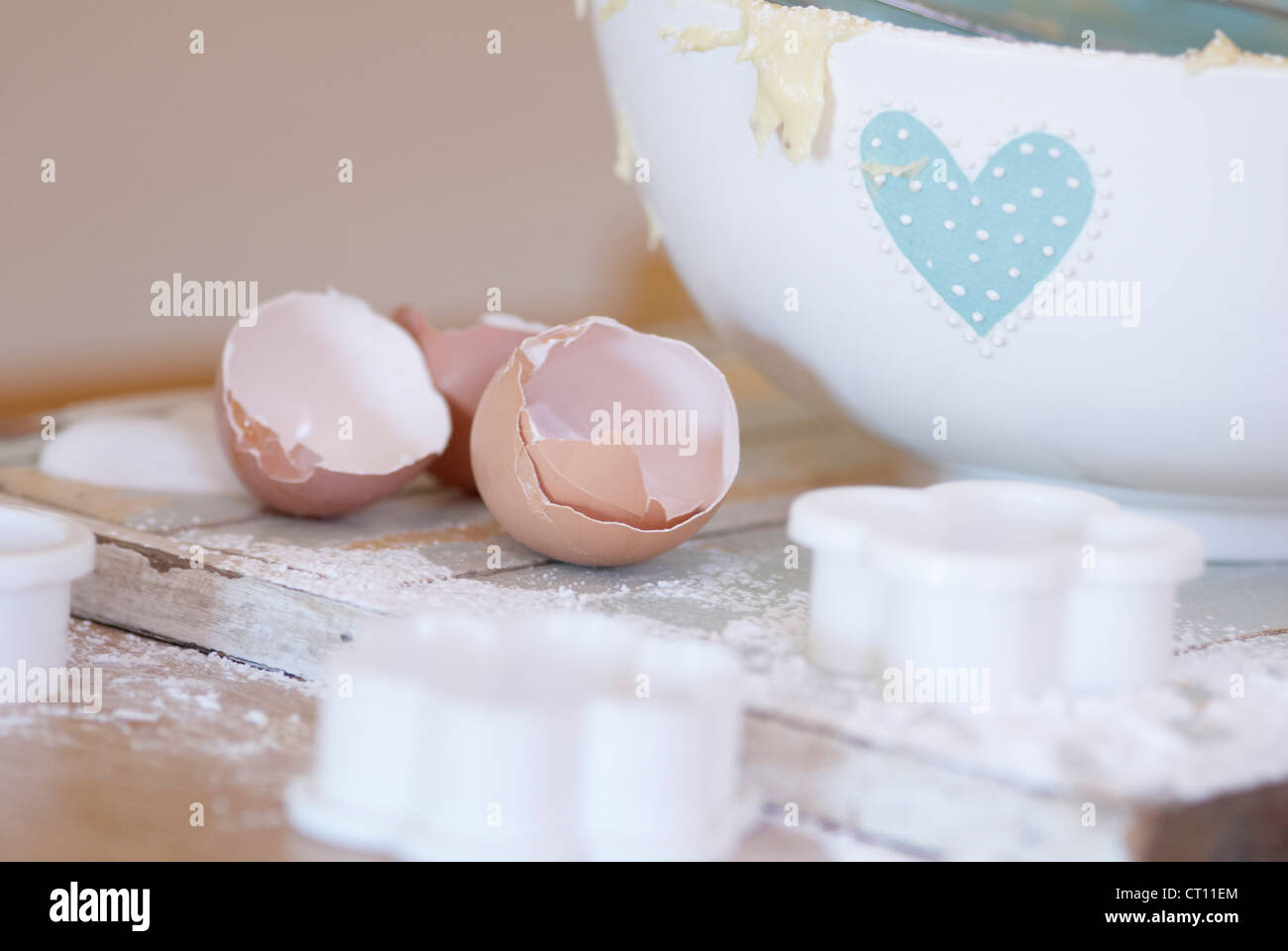 Eggs, cookie cutters and bowl in kitchen Stock Photo Alamy