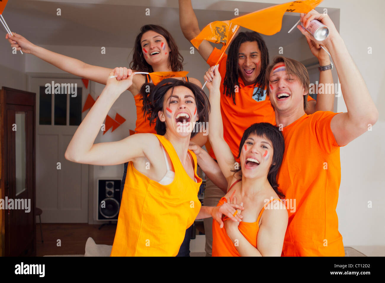 Friends cheering for sports together Stock Photo