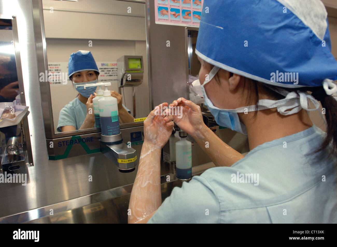 A surgeon scrubbing up before an operation Stock Photo Alamy