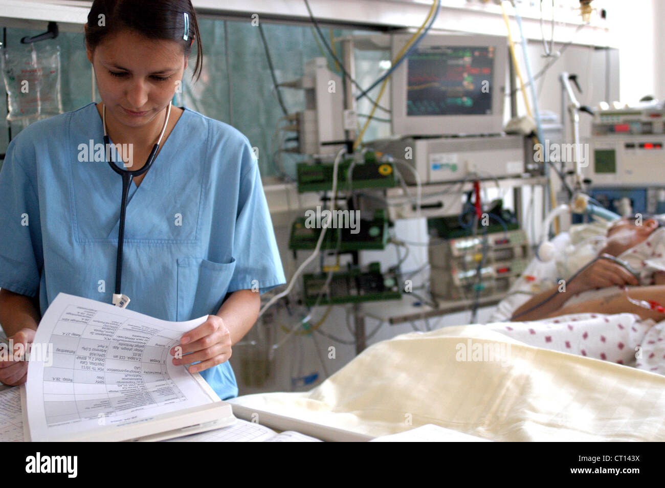 Physican when examining a comatose patient Stock Photo