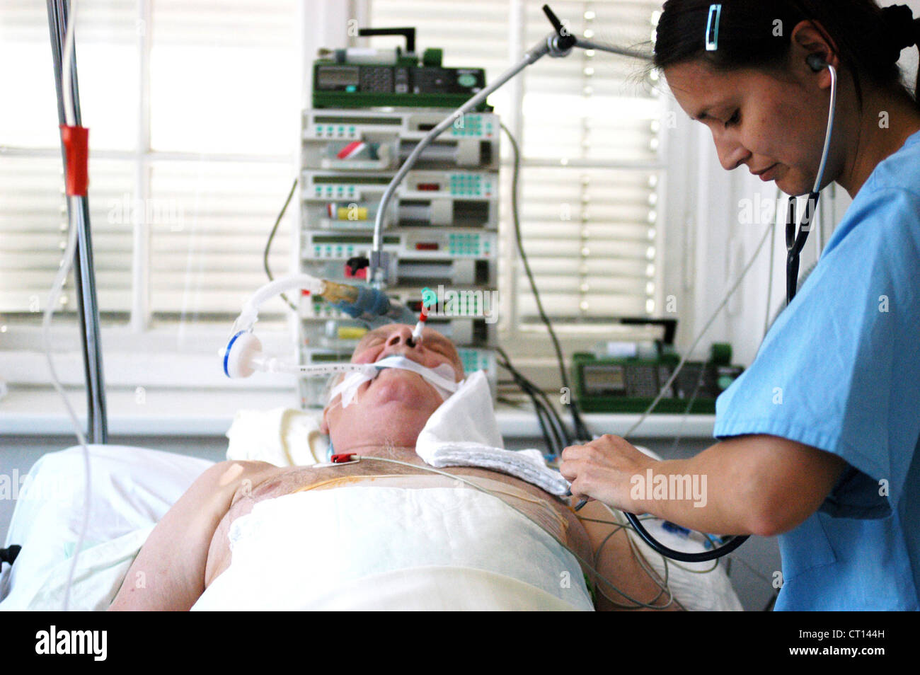 Physican when examining a comatose patient Stock Photo