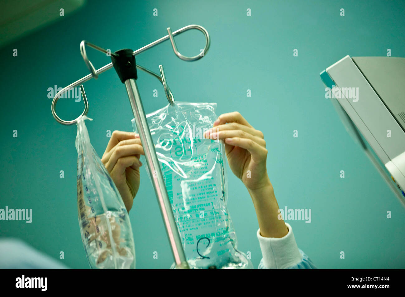 A bag with sodium lactate, also known as Hartmann's solution, is prepared for intravenous infusion. Stock Photo