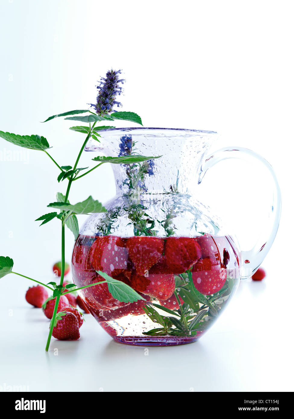 Pitcher of fruit, herbs and water Stock Photo Alamy
