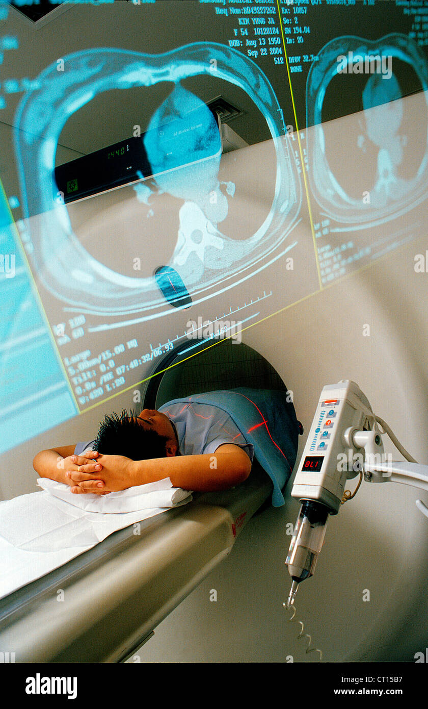A patient undergoes a CT scan under care of staff at the Samsung Medical Center. Stock Photo