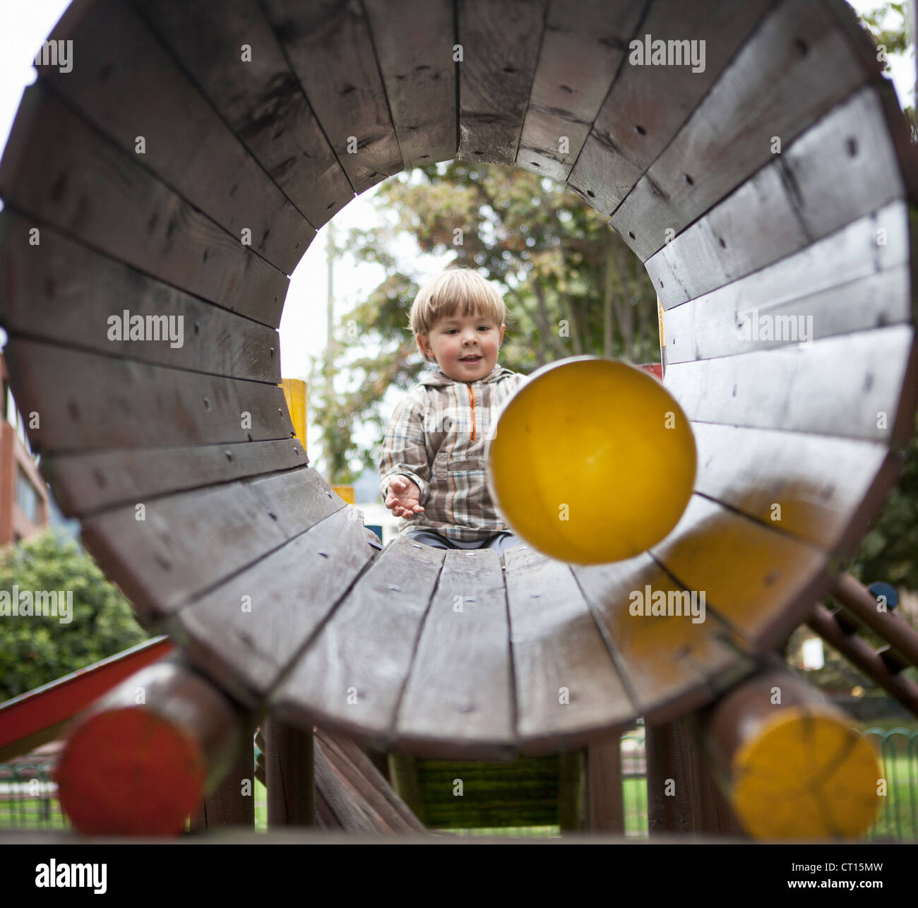 Boy playing with ball on playground Stock Photo - Alamy