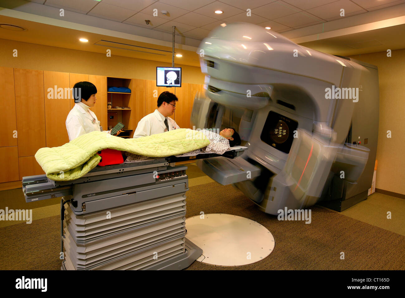A patient undergoes a CT scan under care of staff at the Samsung Medical Center. Stock Photo